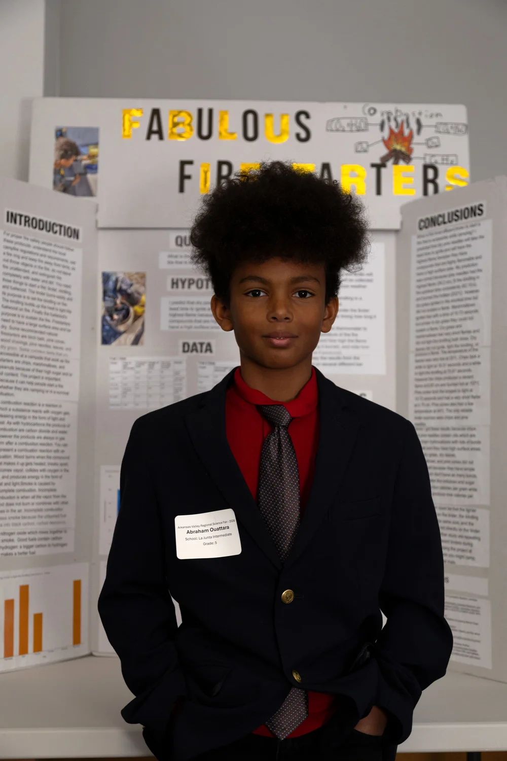 Abraham Ouattara, a fifth grader from La Junta, investigated which type of firestarter would light the quickest. He was surprised to learn that potato chips worked really well. Ouattara won the Outstanding Lower Fair award in recognition of Top Lower Fair Project and the NASA Earth Systems Science Award. Photo: Chelsea Casabona, Rocky Mountain PBS