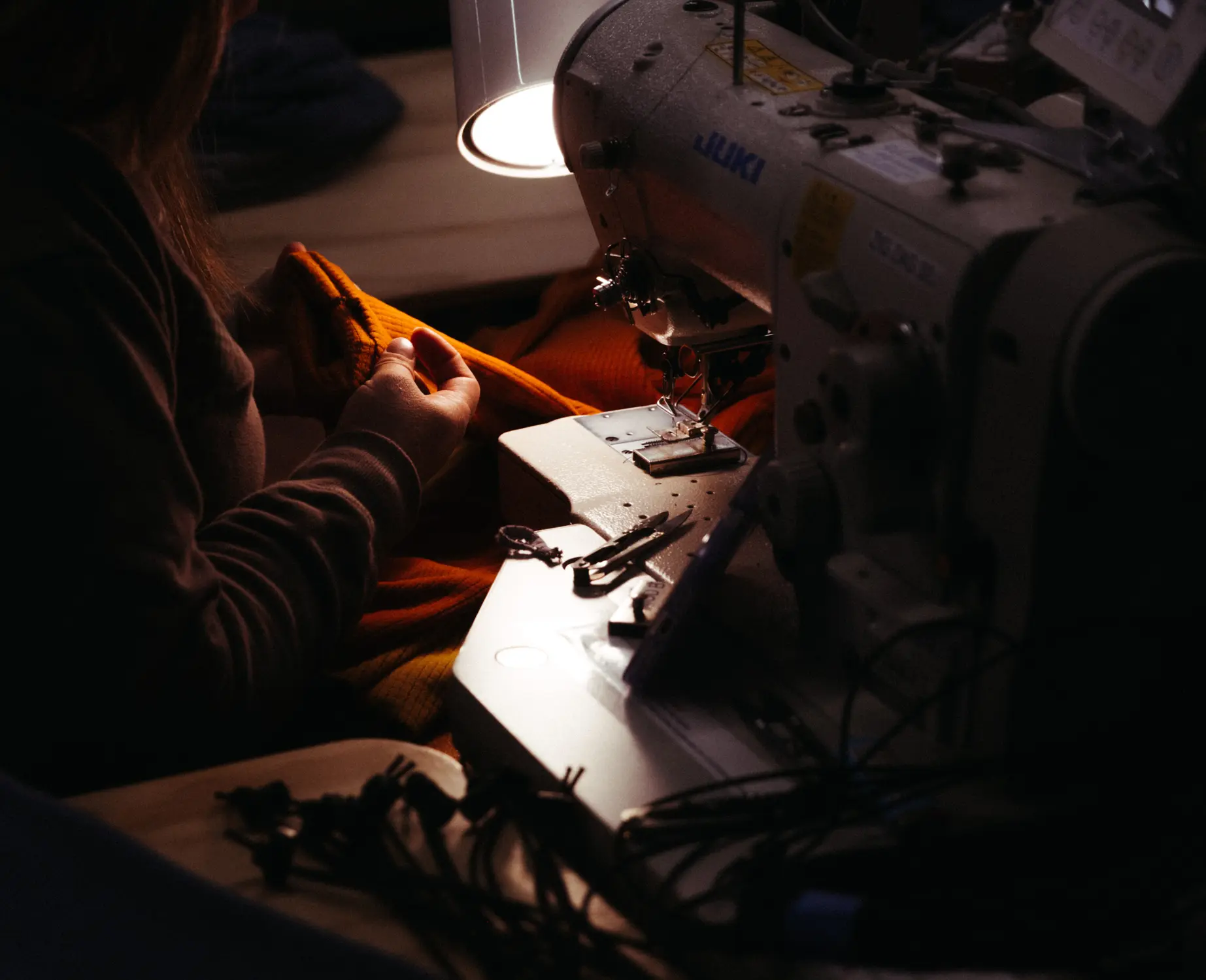 Melanzana's sewers do not need prior experience to join the company. Kelly West, Melanzana’s head of manufacturing, said the training process can take up to four months. Photo: Kyle Cooke, Rocky Mountain PBS