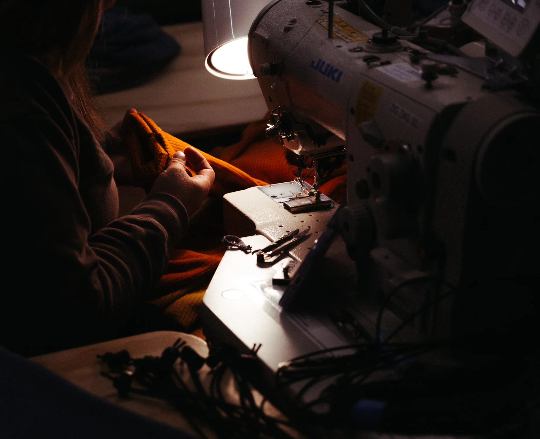 Melanzana's sewers do not need prior experience to join the company. Kelly West, Melanzana’s head of manufacturing, said the training process can take up to four months. Photo: Kyle Cooke, Rocky Mountain PBS