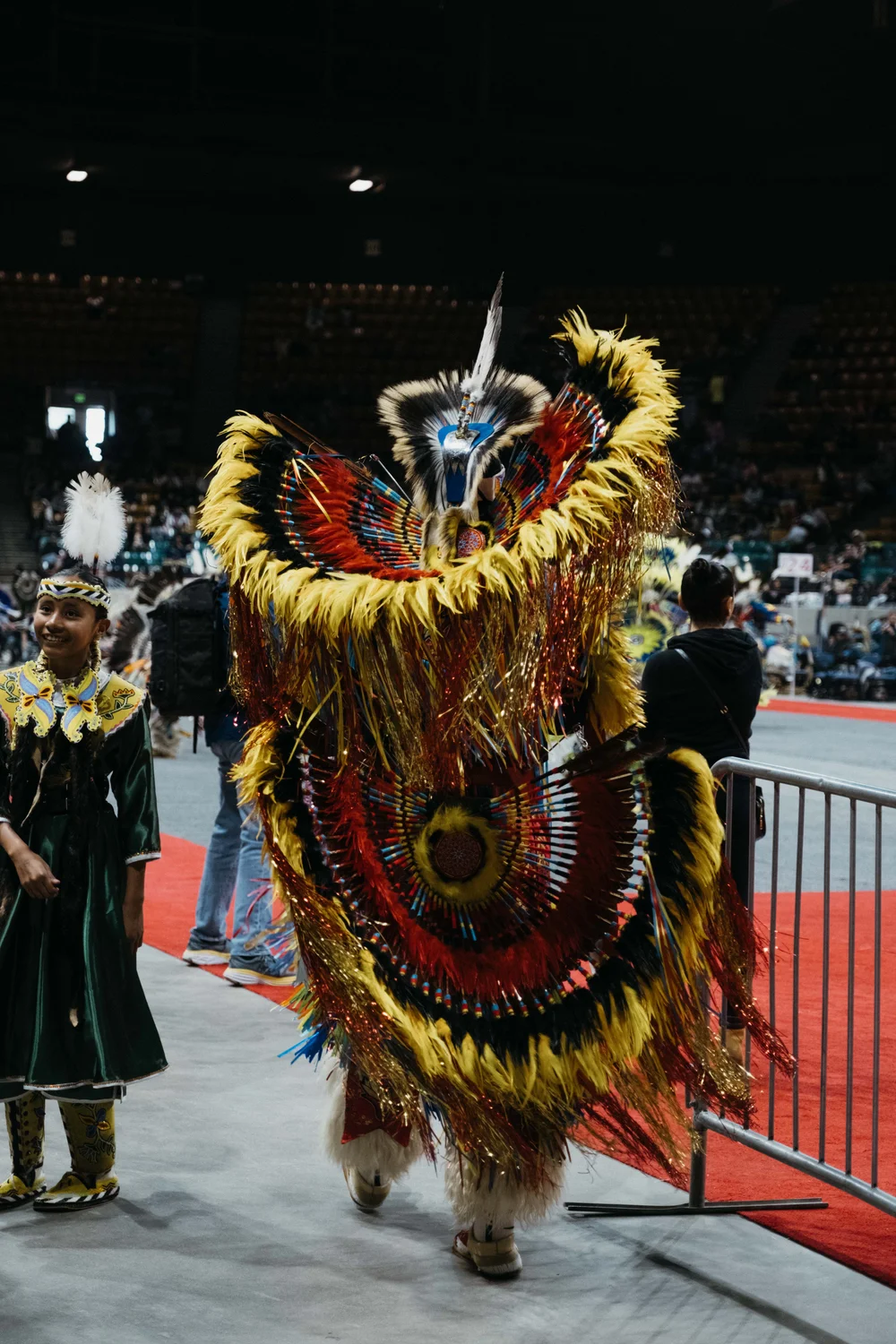 Stan Aschenbrenner’s fancy dance regalia weighed about 40 pounds. His friends and family help him make his regalia, which includes about 10,000 feathers. Photo: Peter Vo, Rocky Mountain PBS