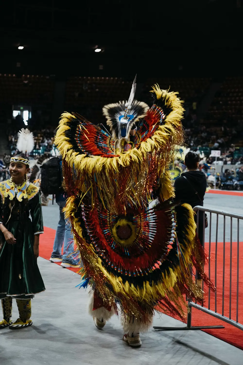 Stan Aschenbrenner’s fancy dance regalia weighed about 40 pounds. His friends and family help him make his regalia, which includes about 10,000 feathers. Photo: Peter Vo, Rocky Mountain PBS