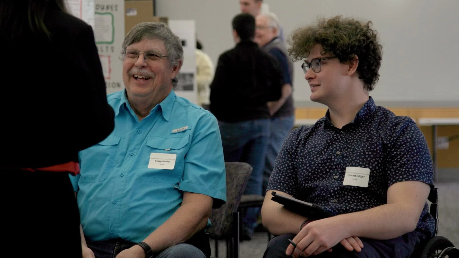 Judges Steve Keefer and Everett Everett Ediger speak with a student about their project. Photo: Chelsea Casabona, Rocky Mountain PBS