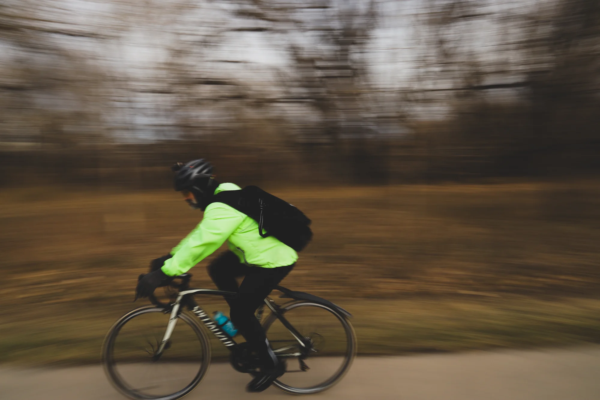 A cyclist travels alongside the Poudre River Trail in late November. Photo: Cormac McCrimmon, Rocky Mountain PBS