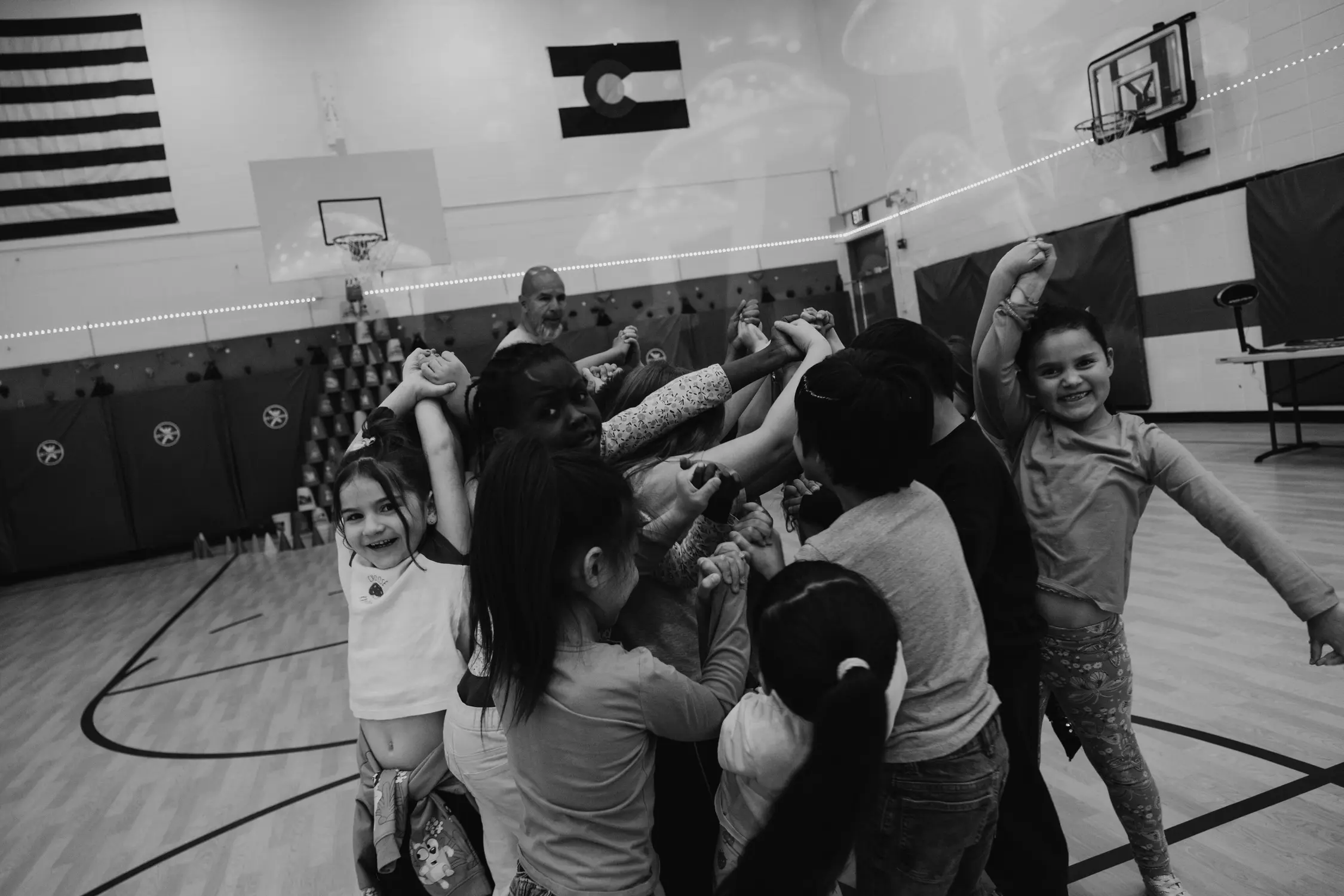 Students are tied in a human knot during PE. Photo: Peter Vo, Rocky Mountain PBS