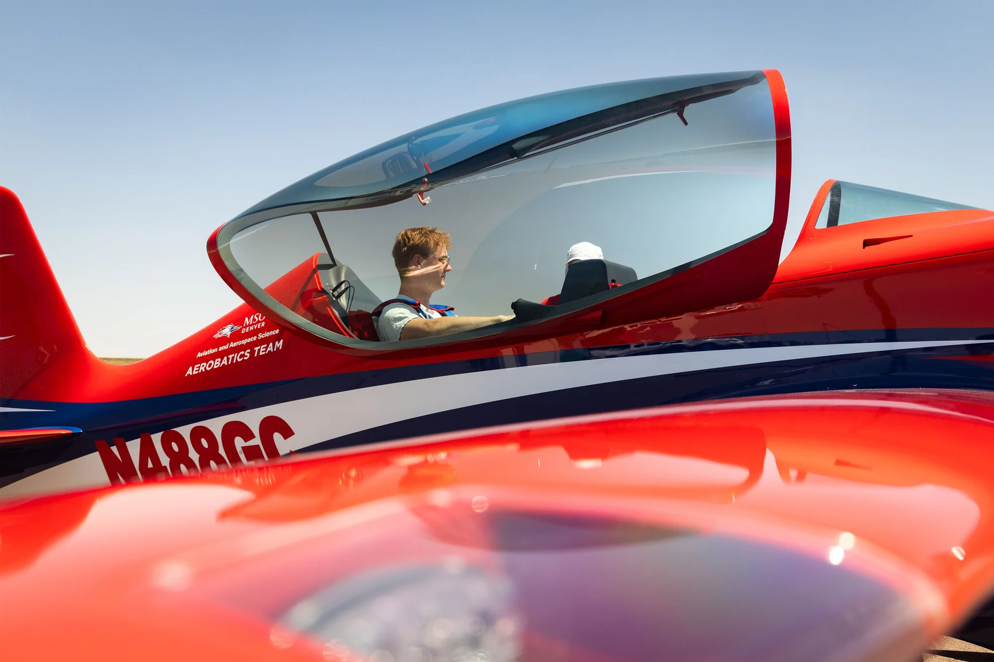 Liam Shetterly sits in MSU Denver’s Game Aerospace Gamebird, an aerobatics airplane donated to the school last year.  Photo: Tien Luu for Rocky Mountain PBS