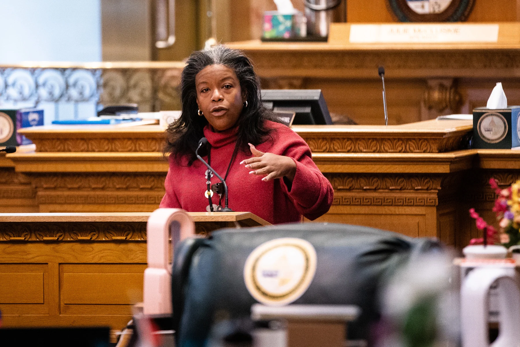 Democratic House Assistant Majority Leader Jennifer Bacon said she is ready to work on solutions to any harmful policies put forward on the federal level by the incoming Trump administration. Bacon is pictured here on the House floor on Feb. 23, 2024. Photo: Hart Van Denburg, CPR News