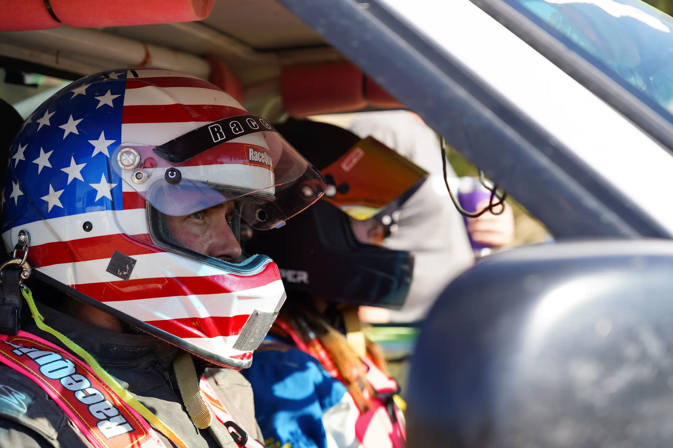 Christopher Feagin, riding in his sister’s race vehicle, waits for a practice run to start at the hill climb. Photo: Joshua Vorse, Rocky Mountain PBS
