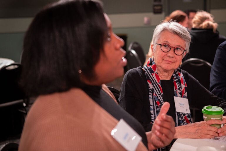 Above the Noise event, person speaking at table