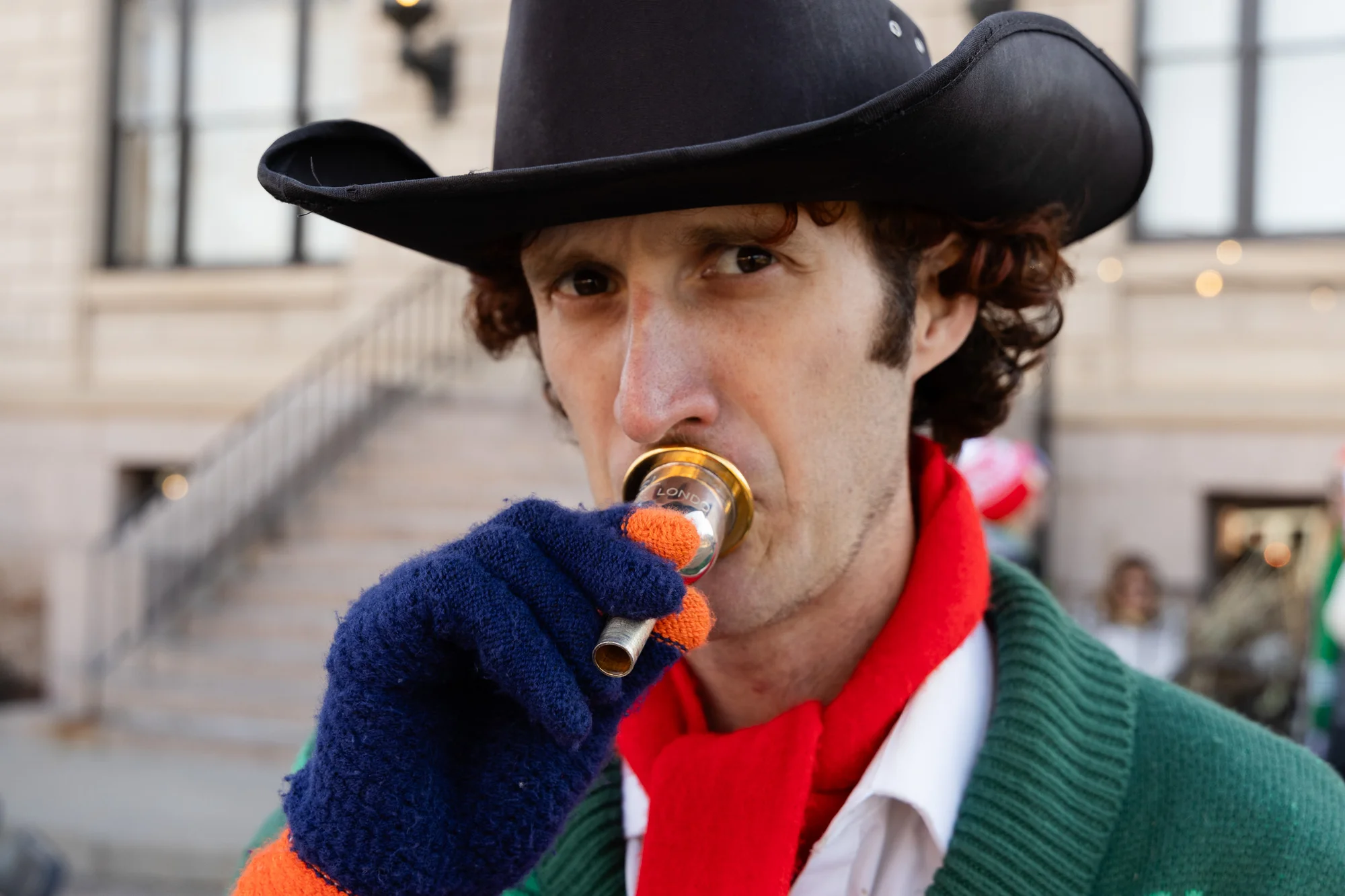 Travis Wohlstadter, 32, of Fort Collins warms his mouth piece before the show. “Two years ago it was super cold,” said Wohlstadter. He’s since learned to play in gloves. Photo: Cormac McCrimmon, Rocky Mountain PBS