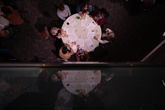 Above the Noise people at round table