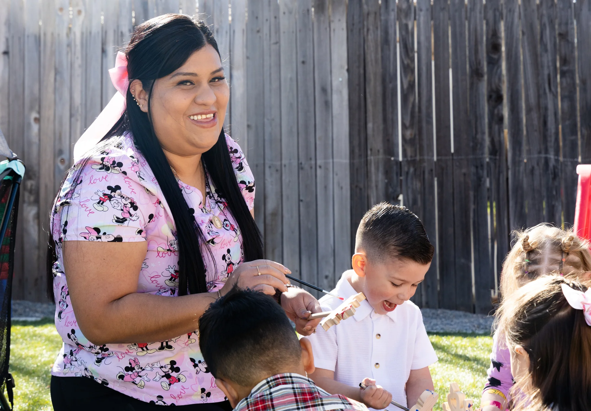 Castañeda Romero has a fenced-in yard connected to her at-home day care center, complete with bicycles, toys and a playpen. Photo: Carly Rose, Rocky Mountain PBS