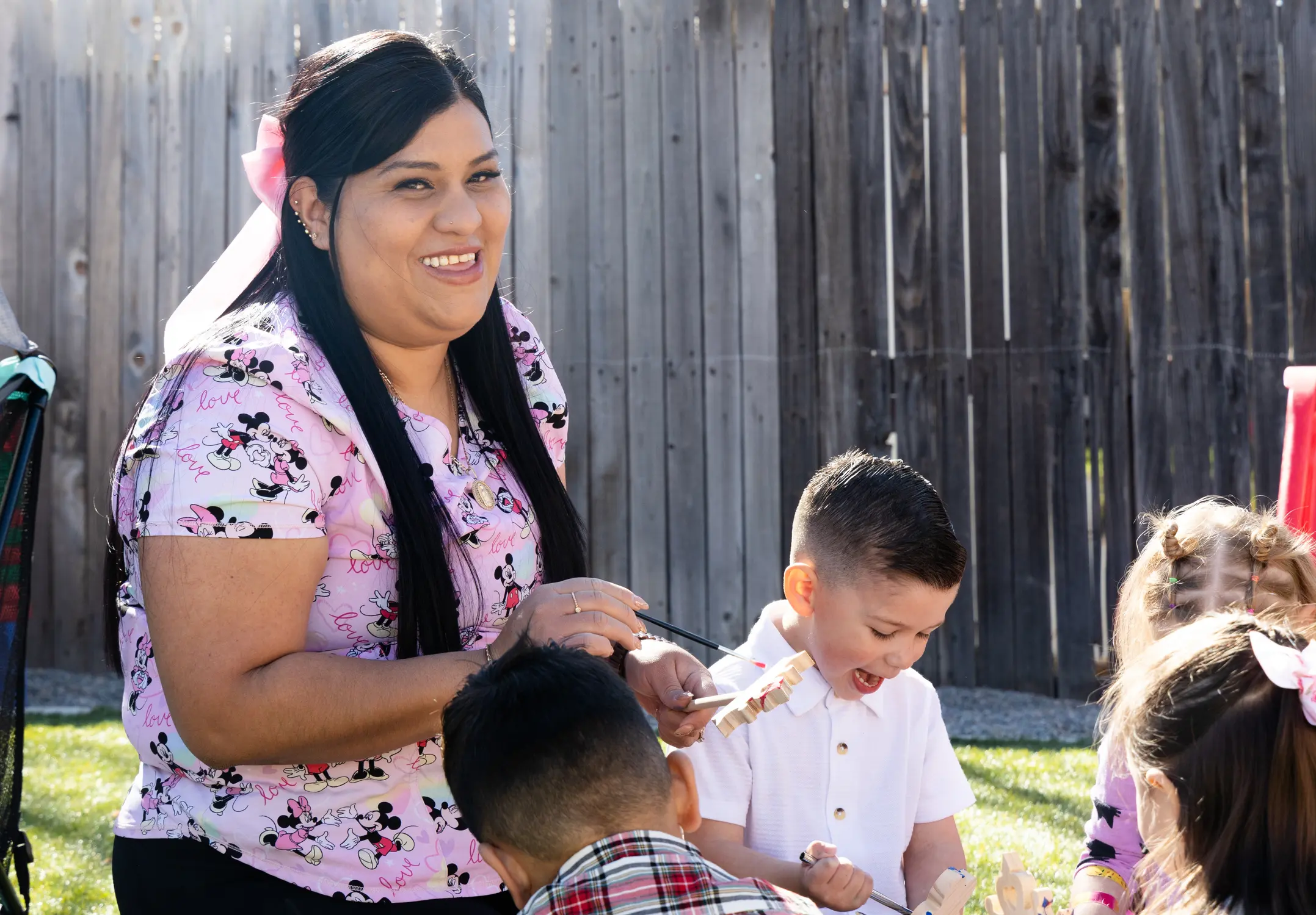Castañeda Romero has a fenced-in yard connected to her at-home day care center, complete with bicycles, toys and a playpen. Photo: Carly Rose, Rocky Mountain PBS