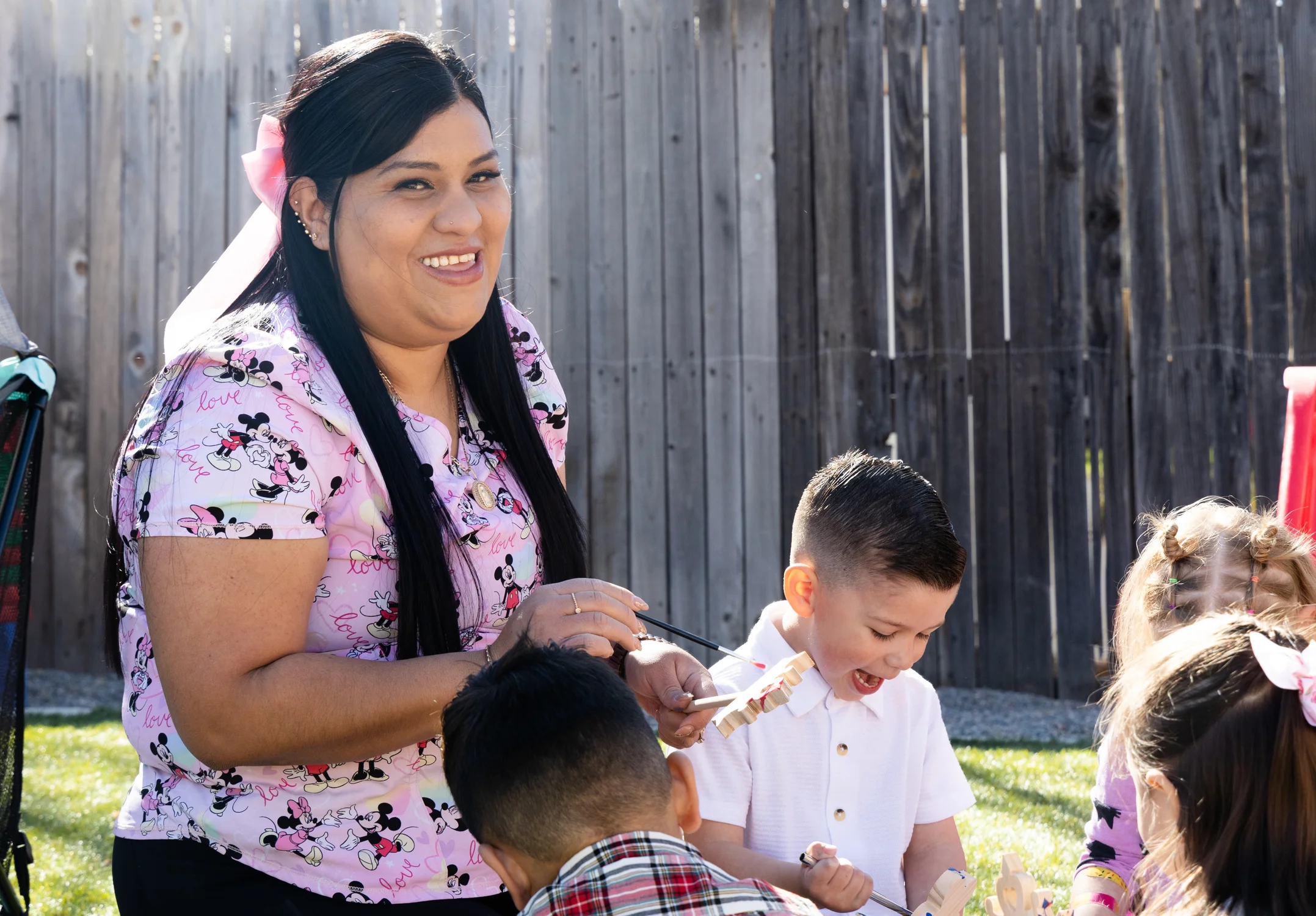 Castañeda Romero has a fenced-in yard connected to her at-home day care center, complete with bicycles, toys and a playpen. Photo: Carly Rose, Rocky Mountain PBS