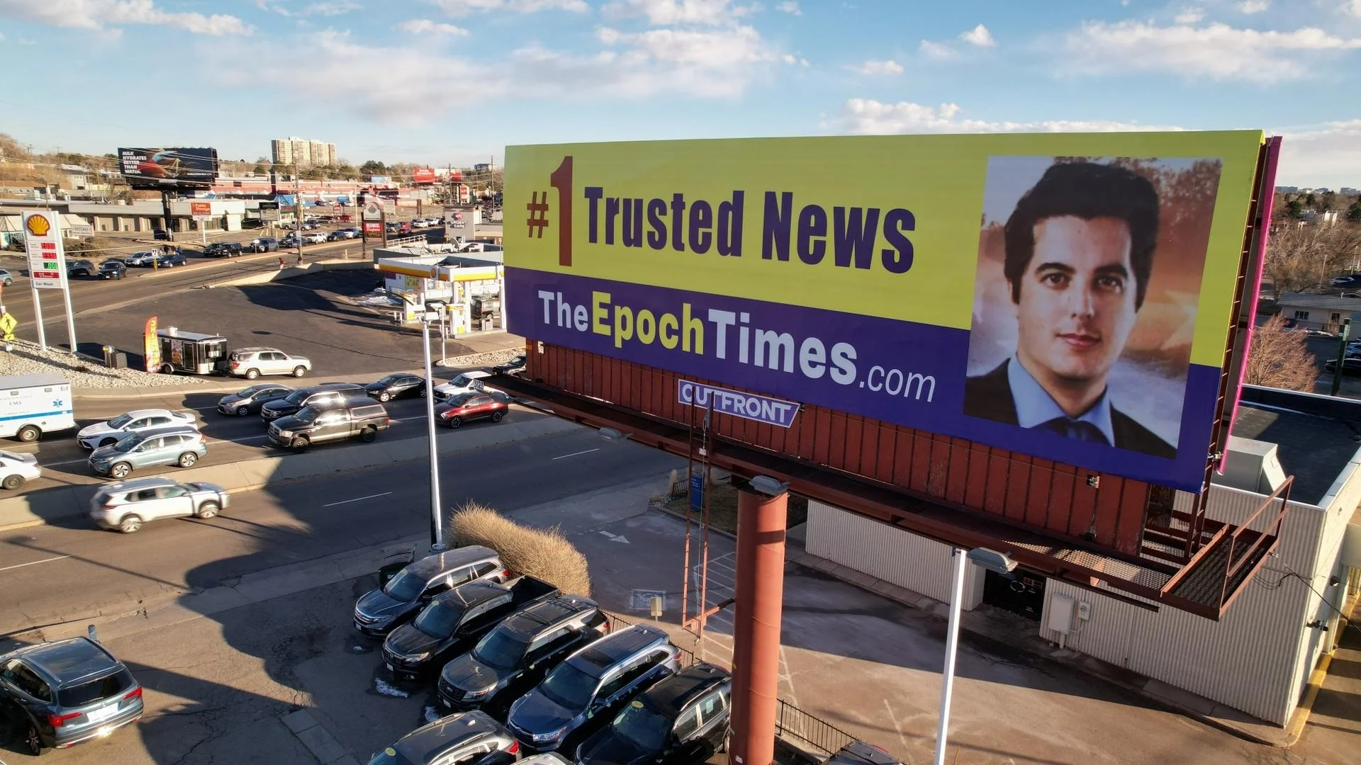 An Epoch Times billboard at the intersection of Monaco and Leetsdale in Denver is identical to other billboards across the country. Photo: Jeremy Moore, Rocky Mountian PBS