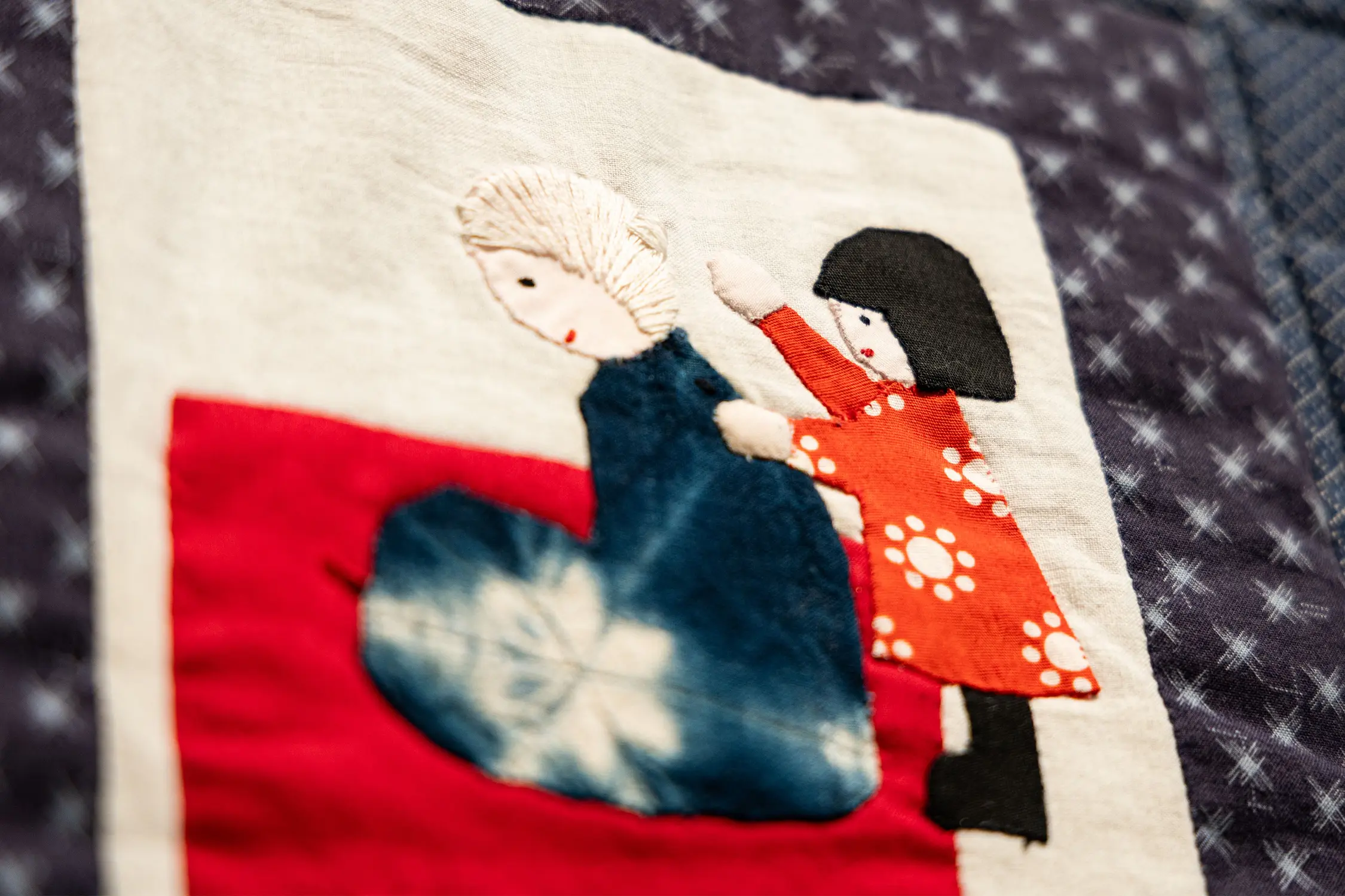 Anna Kato Murahata’s square shows a child giving her mother a massage after a day stooping over the farms. This would be a time for storytelling, according to Murahata. Photo: Chase McCleary, Rocky Mountain PBS