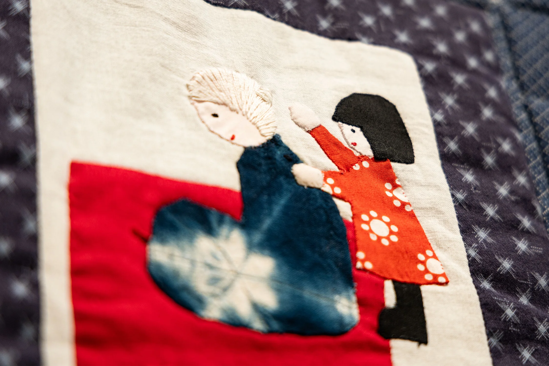 Anna Kato Murahata’s square shows a child giving her mother a massage after a day stooping over the farms. This would be a time for storytelling, according to Murahata. Photo: Chase McCleary, Rocky Mountain PBS