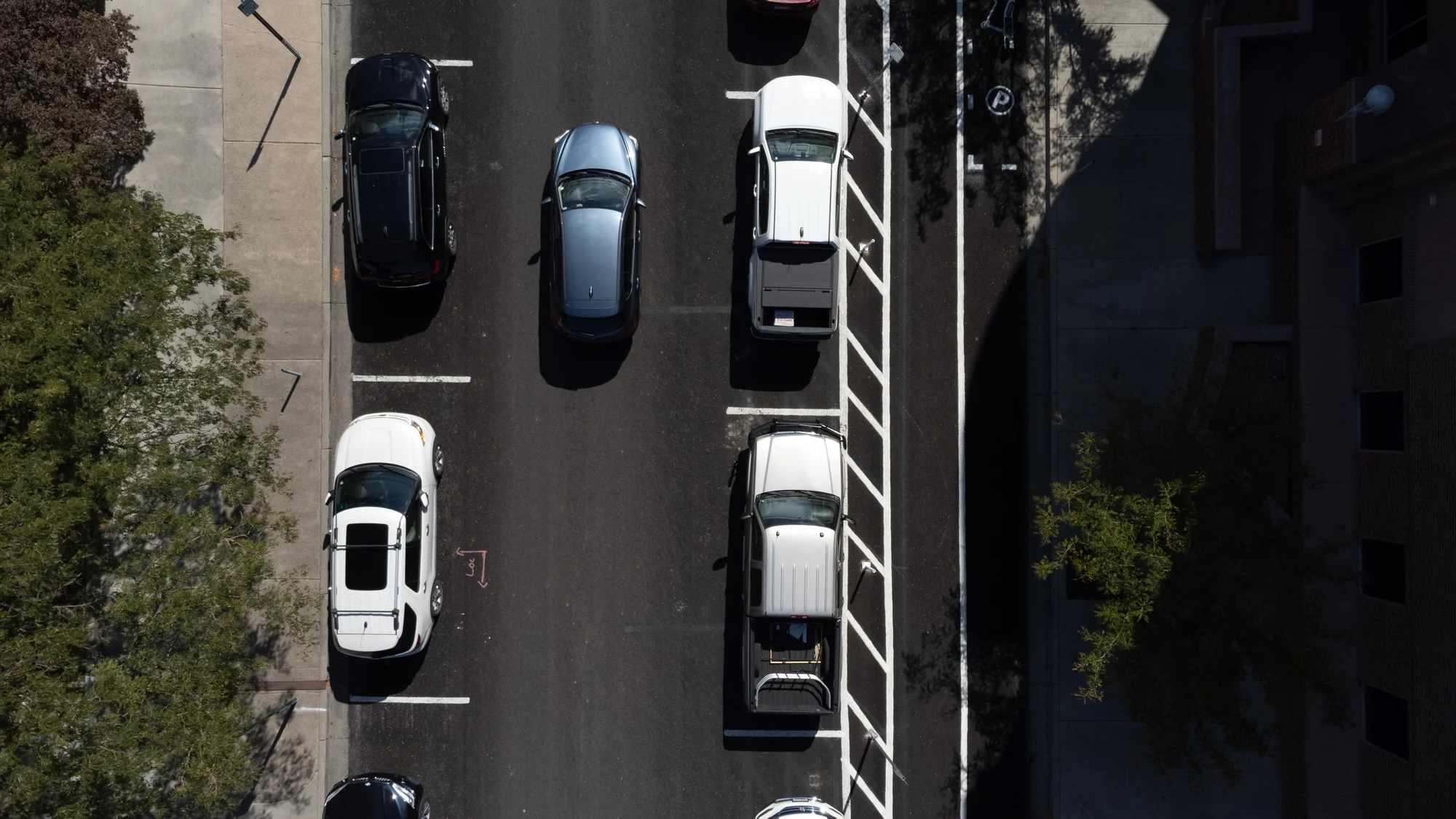 The single driving lane on 4th Street, with parking on either side, and a bike lane on the far right side. Photo: Joshua Vorse, Rocky Mountain PBS