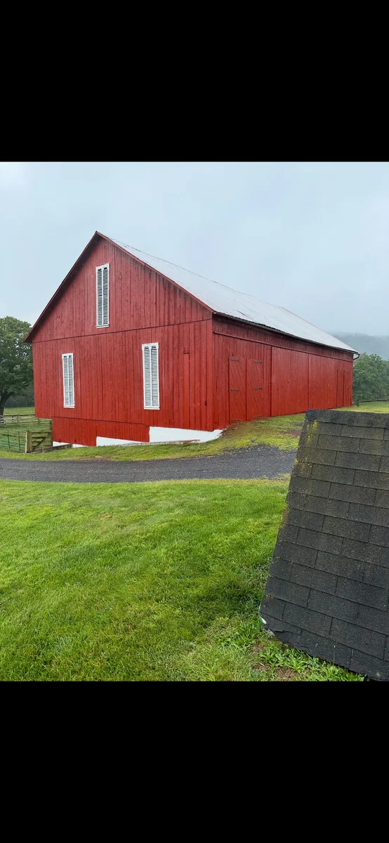 After — Red barn exterior before and after restoration