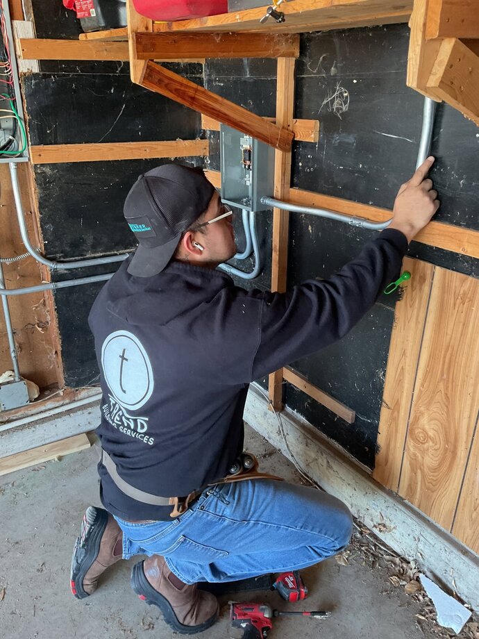 Nu-Trend electrician installing an EV charger