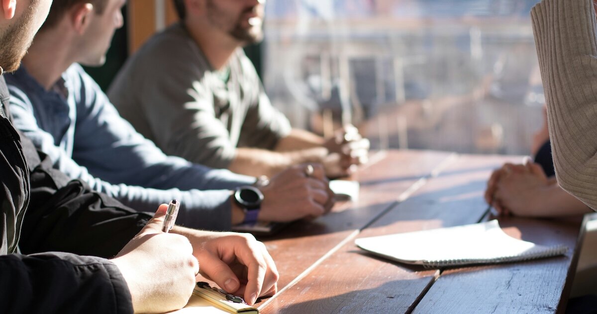 Several professionals meeting at a conference table