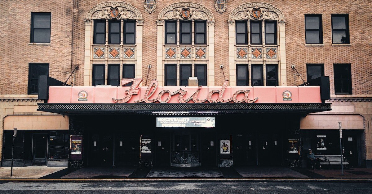The outside of a movie theater in Jacksonville with the word "Florida" in cursive on the marquee.
