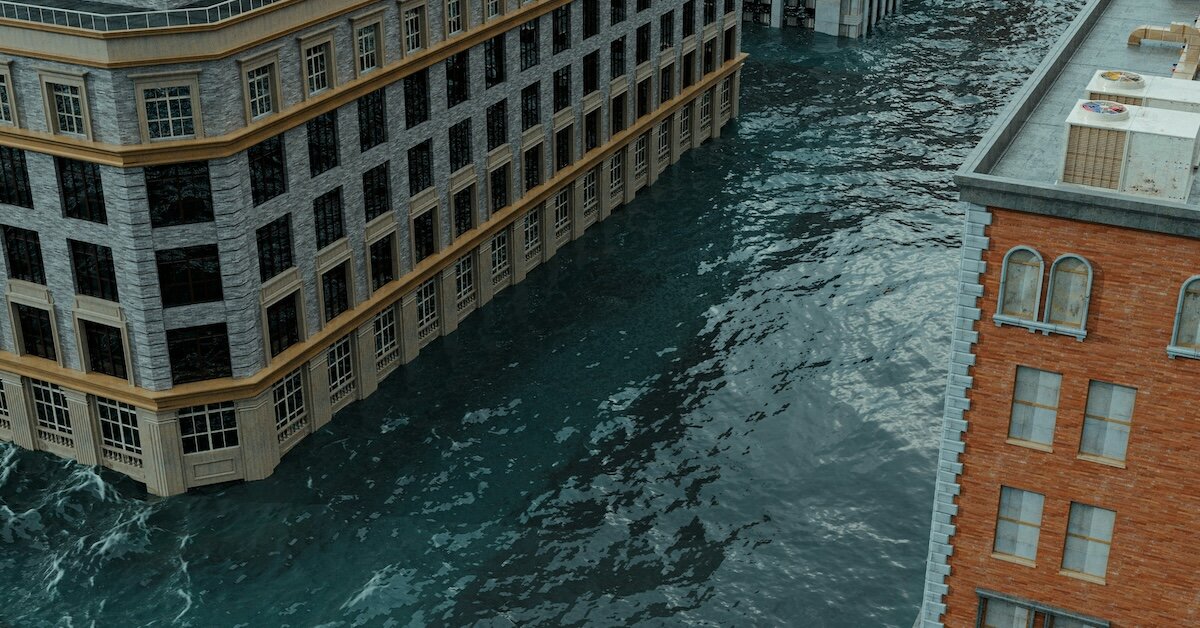 High water levels rise against tall buildings in a flood zone
