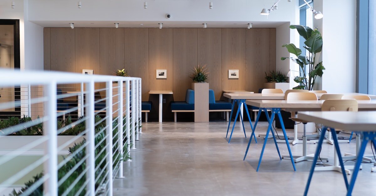 Shared desk and communal sitting area in an office