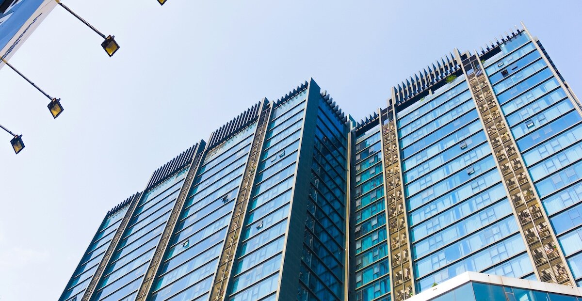 A large commercial real estate building with shiny glass windows