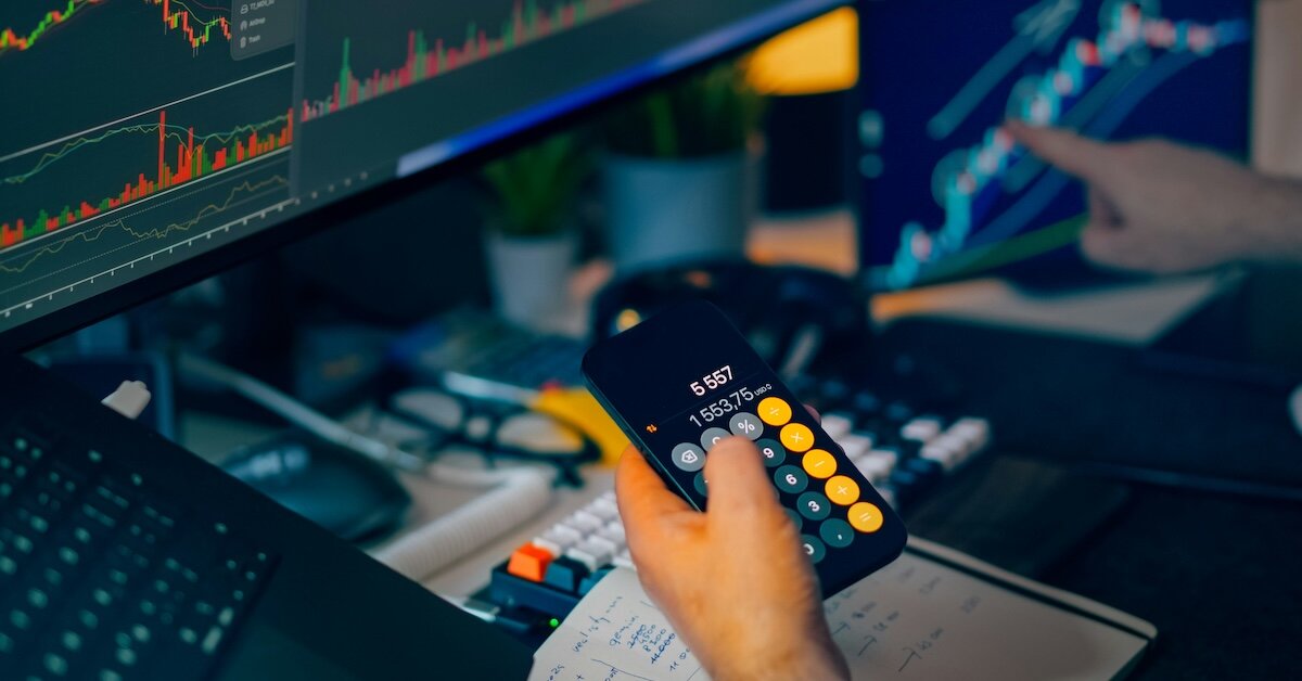 someone using their calculator to do a quick valuation check