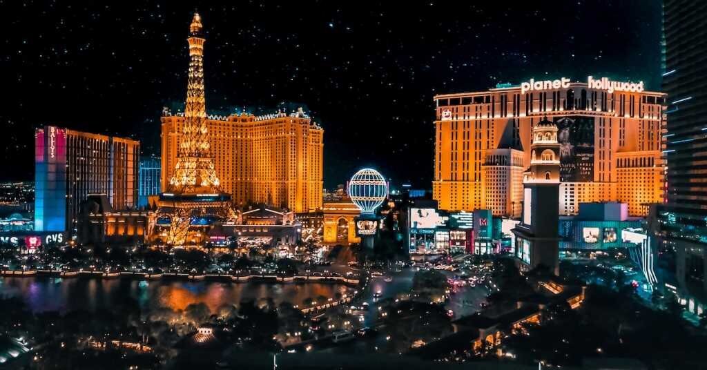 A view of the Las Vegas strip at night with lit-up hotels and casinos