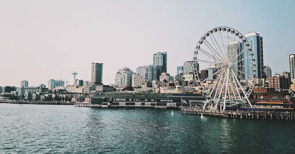 Seattle's pier and ferris wheel with the space needle in the background
