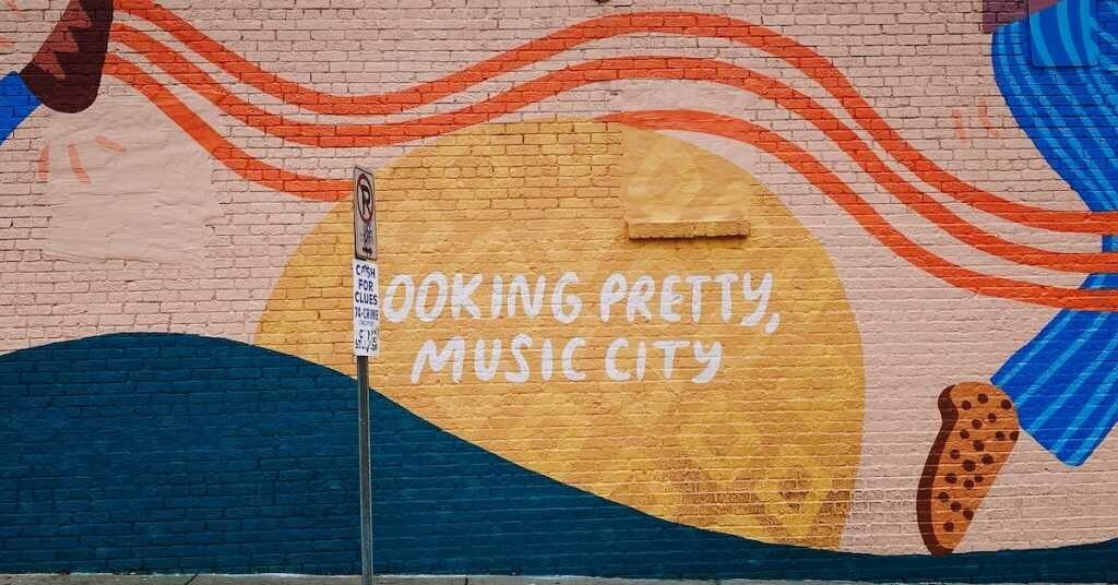 A mural in Nashville that reads, "Looking Pretty, Music City"