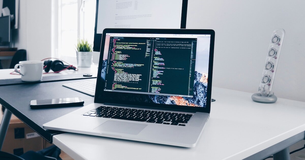 a laptop with code for AI features on it