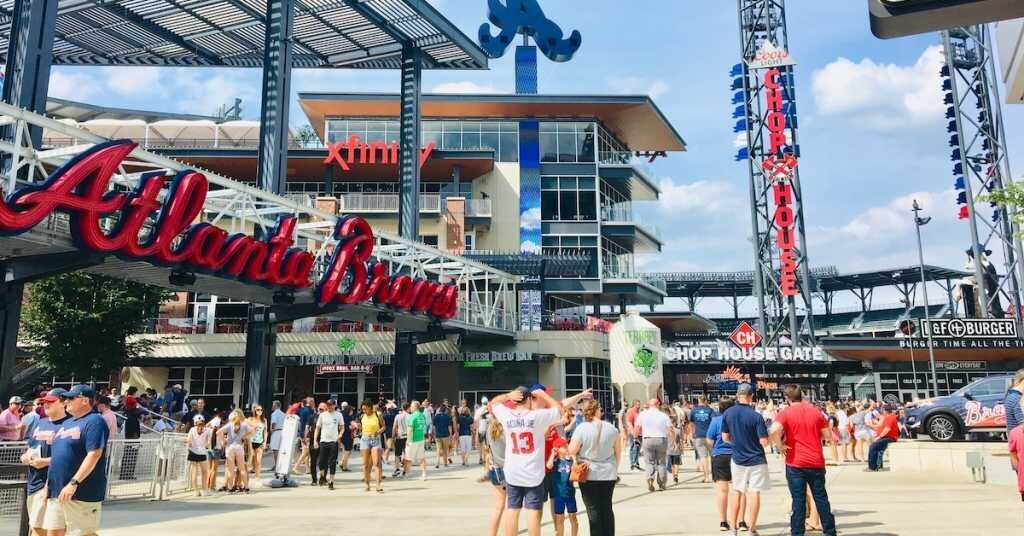 People mill about the outside of an Atlanta sports arena