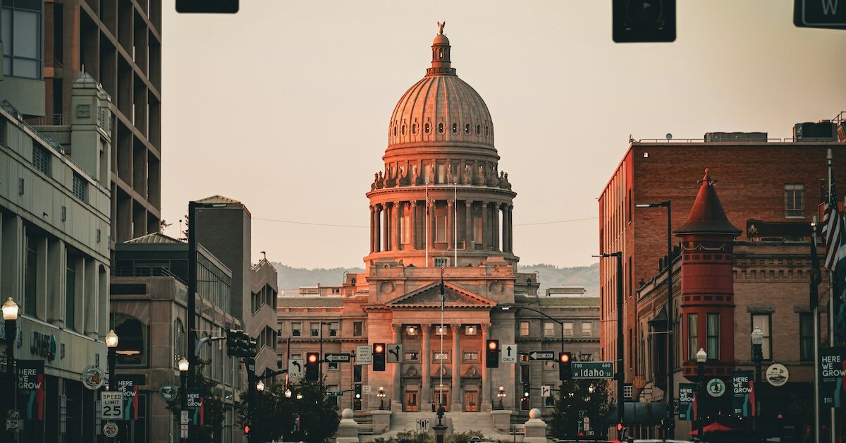 A view of downtown Boise's city hall, with offices and shops lining the shot from the street