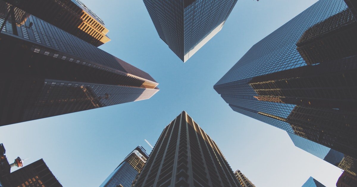 An upward view point of tall commercial real estate skyscrapers