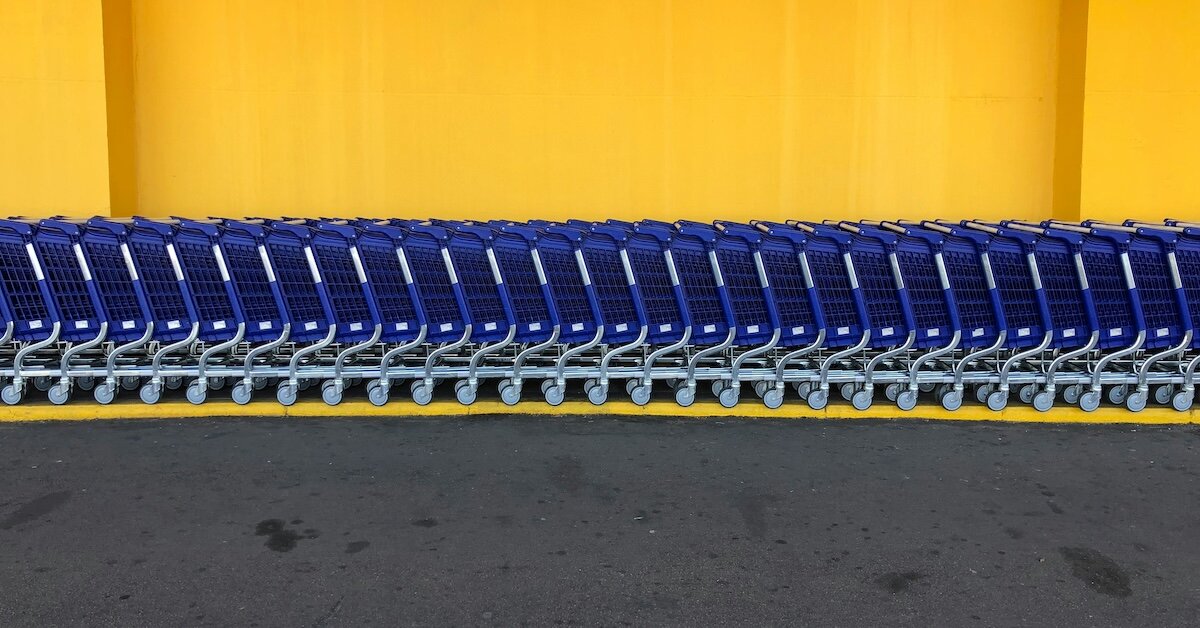 Blue grocery carts in a line