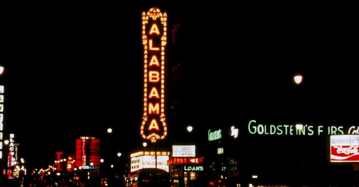 A lit-up sign that says Alabama in a downtown corridor in Birmingham