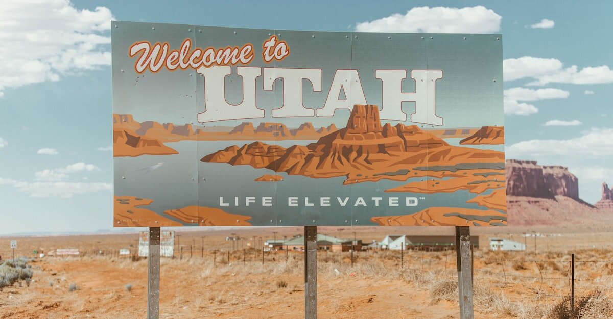 a sign reads "welcome to Utah," which is a great place to buy land