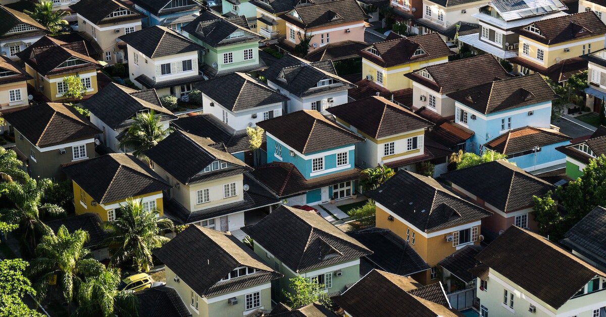 Overhead view of a grid of residential houses.