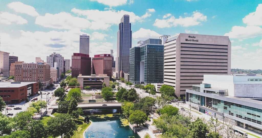 The downtown cityscape of Omaha, with Omaha World Bank's marquee in the foreground of the buildings