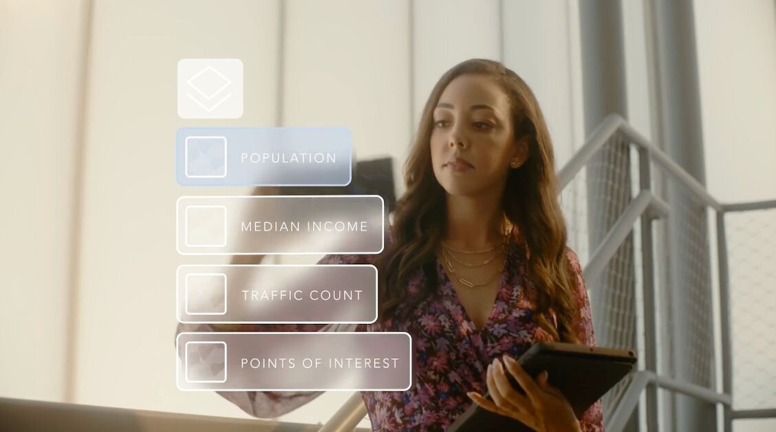 the owner of a bar consults a clipboard of information