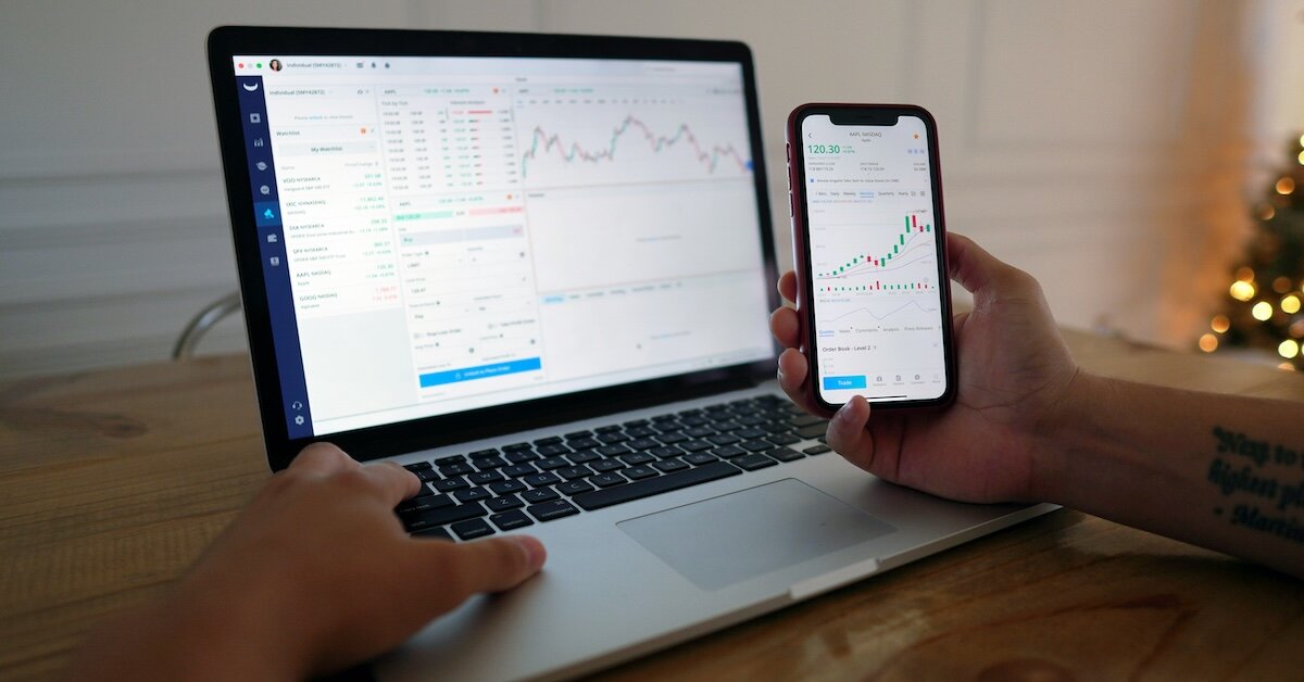 a person looking at their computer calculating comps data