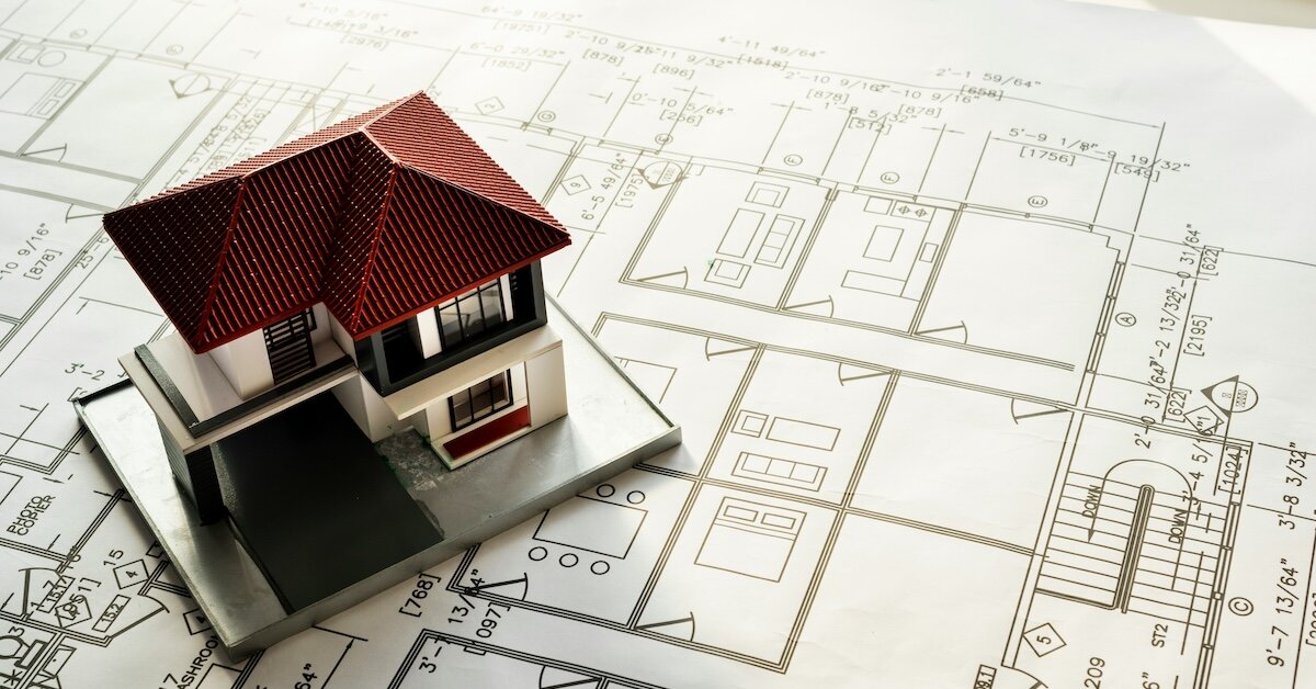 a model single family home on top of floor plans