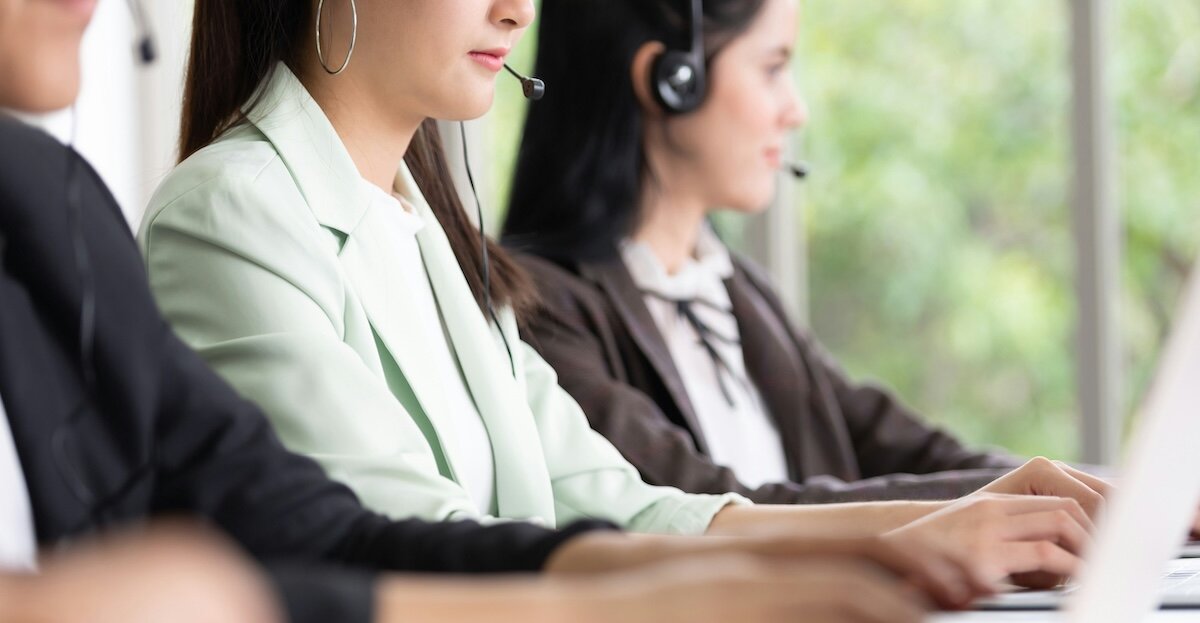 reps making sales calls sitting at computers