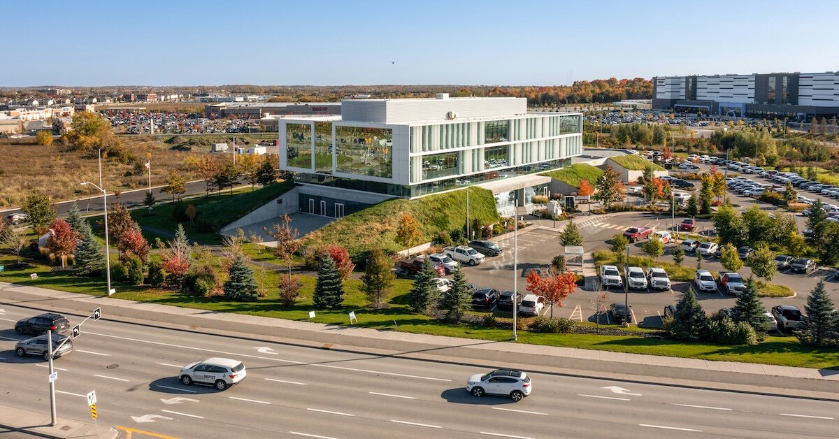 An industrial logistics office on the side of a busy road