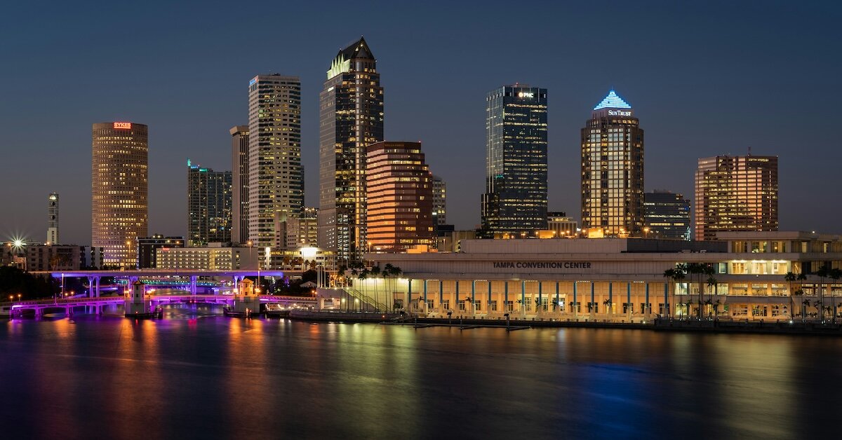 Downtown Tampa's skyscrapers at night reflecting off the bay