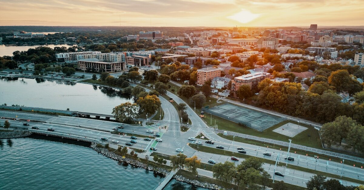 Sunset behind downtown Madison Wisconsin, next to the water's edge.