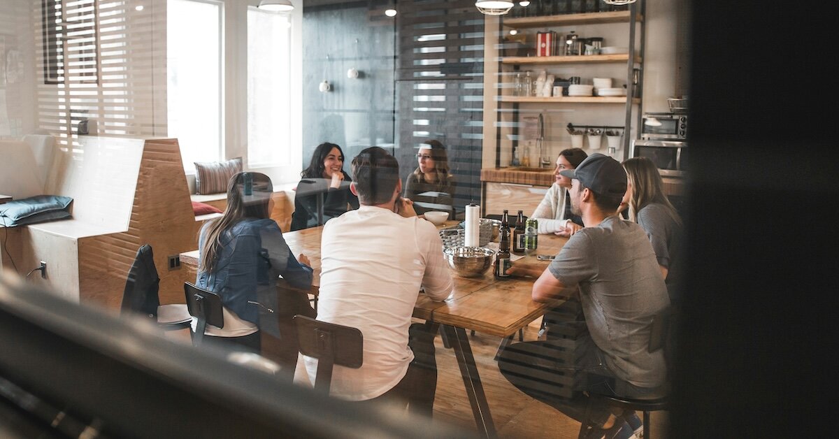 Business professionals review meet in a casual office conference room
