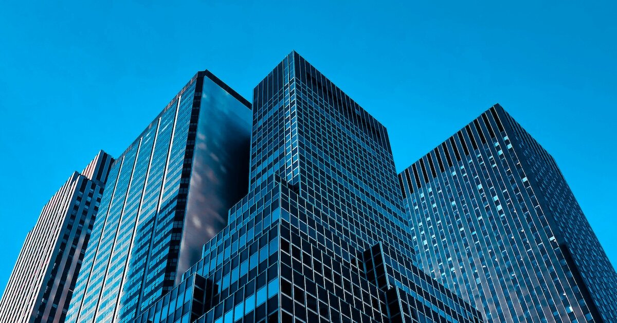 blue real estate buildings against a dark sky
